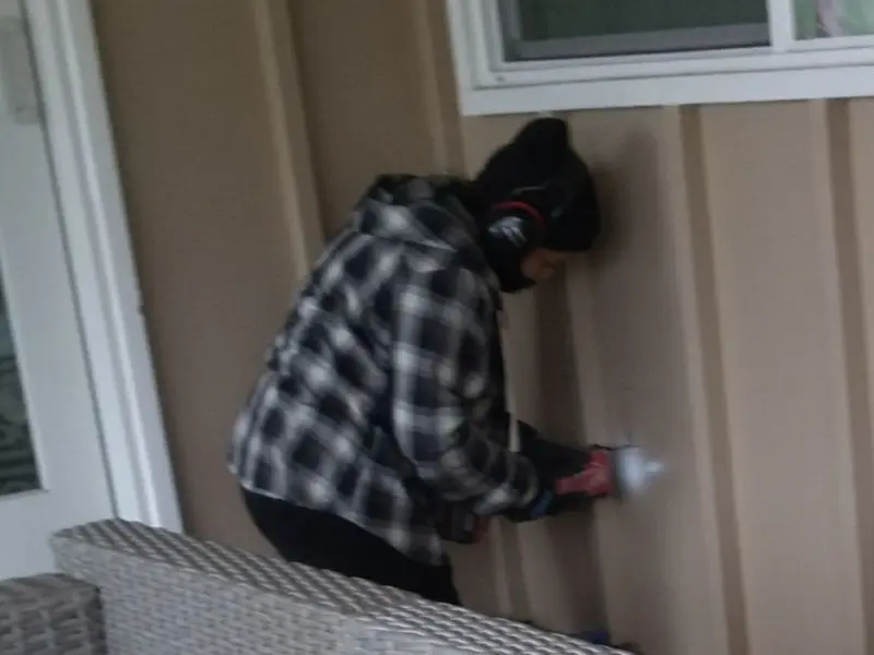 Professional electrician installing an exterior outlet in Algona