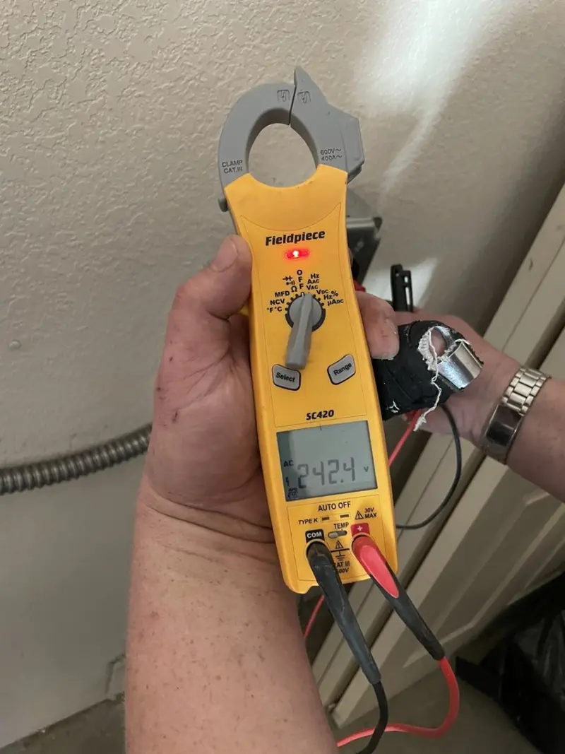 Voltage testing with clamp meter during Ceiling Fan Installation in Algona